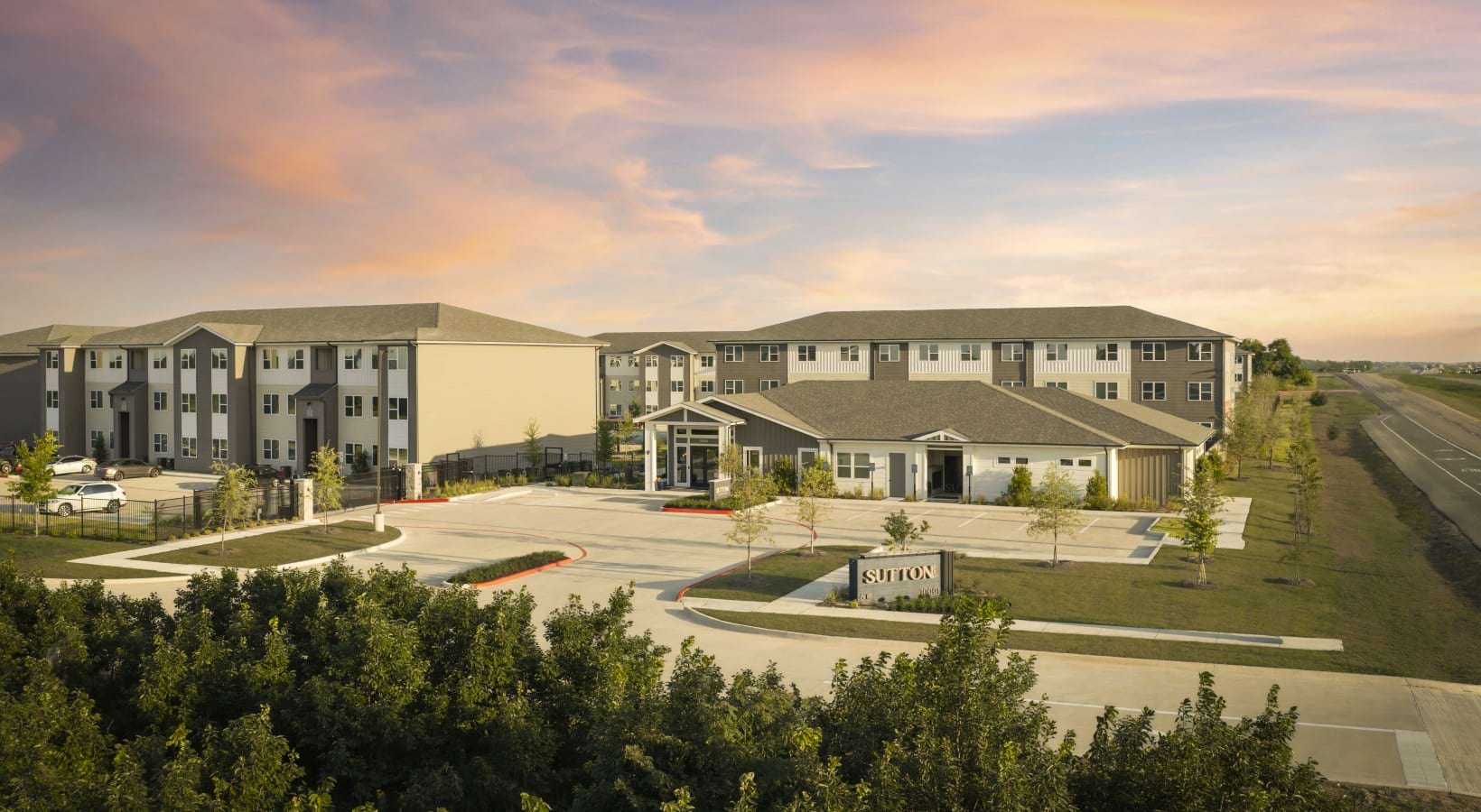 sutton flats apartment buildings with parking spaces in front