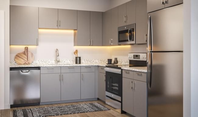 a kitchen with white cabinets